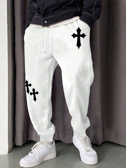 Manfinity EMRG Men'S Street Style Black Asymmetric Cross Print Tapered Sweatpants with White Track Pants.