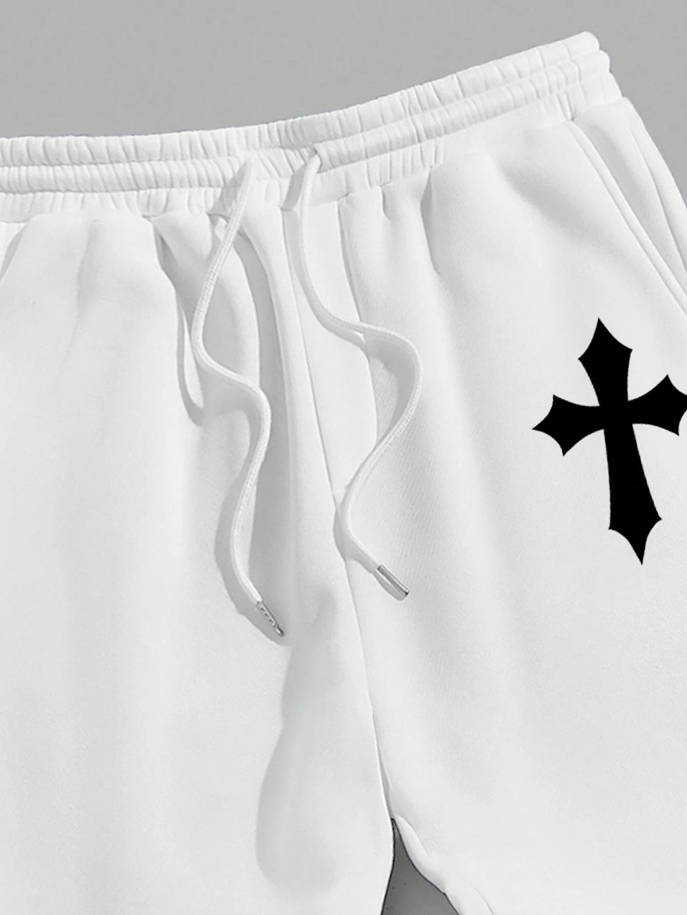 Manfinity EMRG Men'S Street Style Black Asymmetric Cross Print Tapered Sweatpants with White Track Pants.