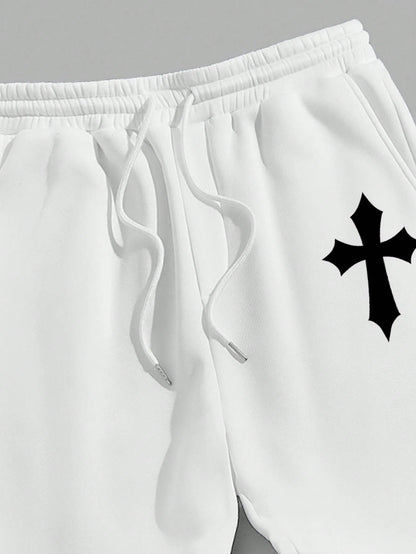 Manfinity EMRG Men'S Street Style Black Asymmetric Cross Print Tapered Sweatpants with White Track Pants.
