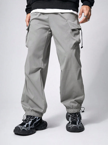 Manfinity EMRG Men Solid Flap Pocket Drawstring Waist Oversized Cargo Baggy Pants