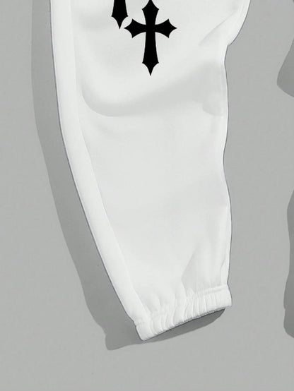 Manfinity EMRG Men'S Street Style Black Asymmetric Cross Print Tapered Sweatpants with White Track Pants.