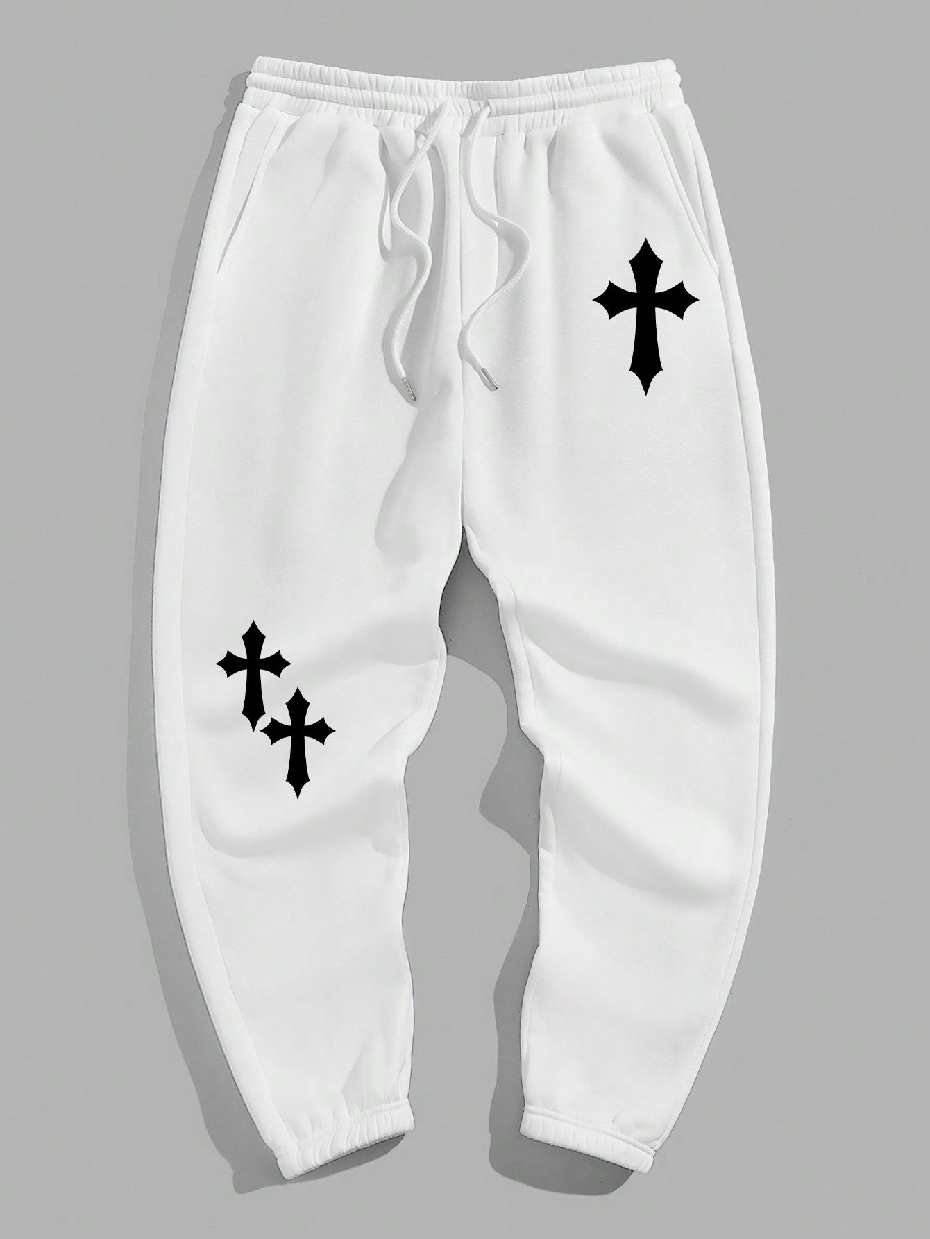 Manfinity EMRG Men'S Street Style Black Asymmetric Cross Print Tapered Sweatpants with White Track Pants.