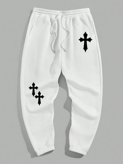 Manfinity EMRG Men'S Street Style Black Asymmetric Cross Print Tapered Sweatpants with White Track Pants.