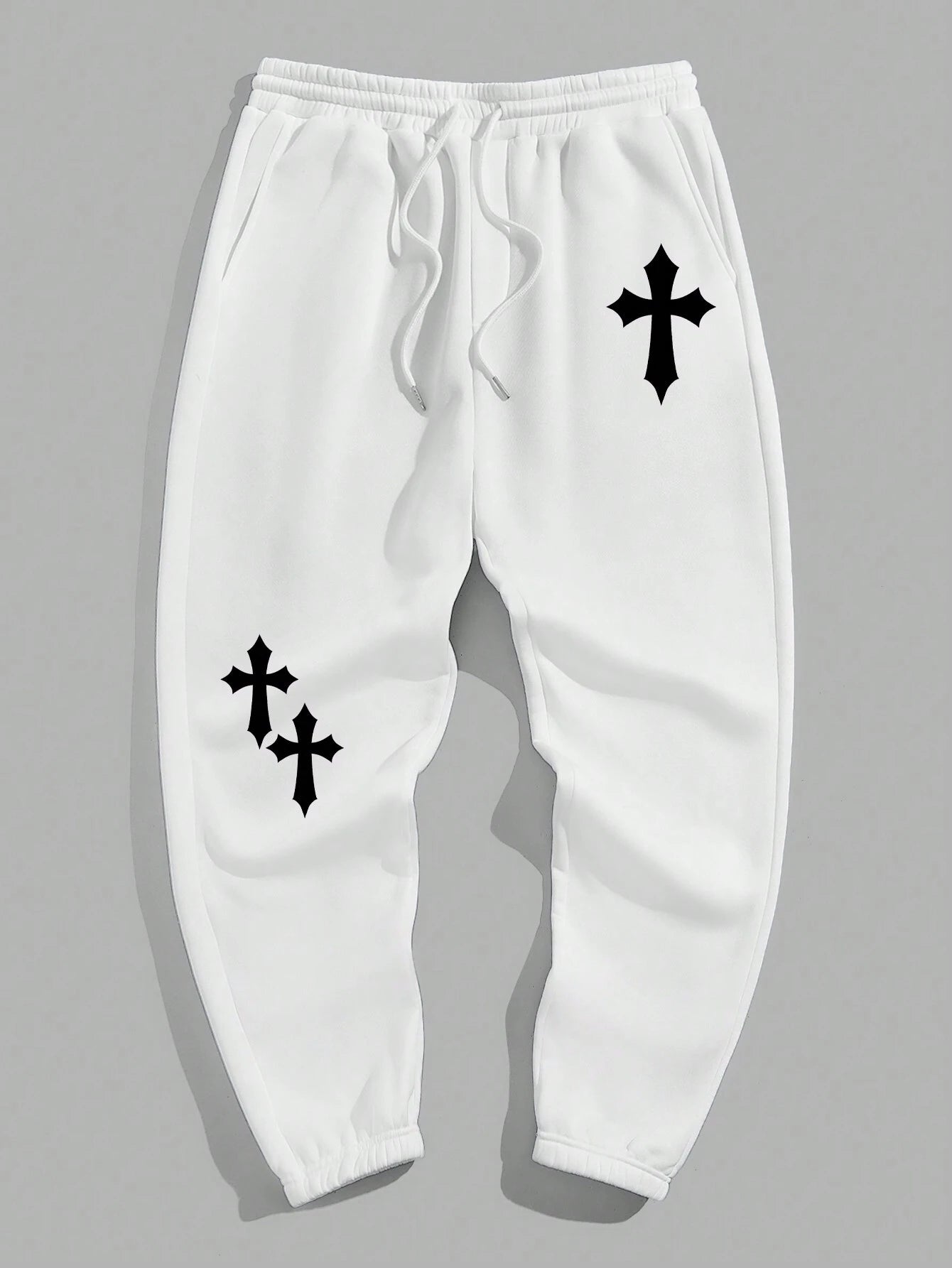 Manfinity EMRG Men'S Street Style Black Asymmetric Cross Print Tapered Sweatpants with White Track Pants.