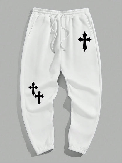 Manfinity EMRG Men'S Street Style Black Asymmetric Cross Print Tapered Sweatpants with White Track Pants.