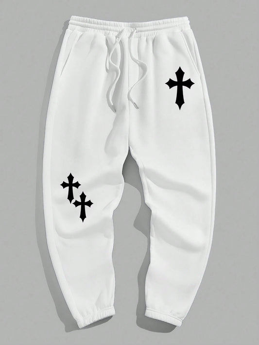 Manfinity EMRG Men'S Street Style Black Asymmetric Cross Print Tapered Sweatpants with White Track Pants.